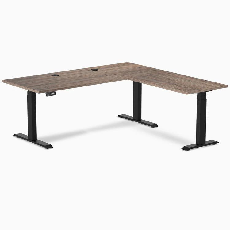 Dual l-shape melamine standing desk - Natural walnut - black 72" with grommets