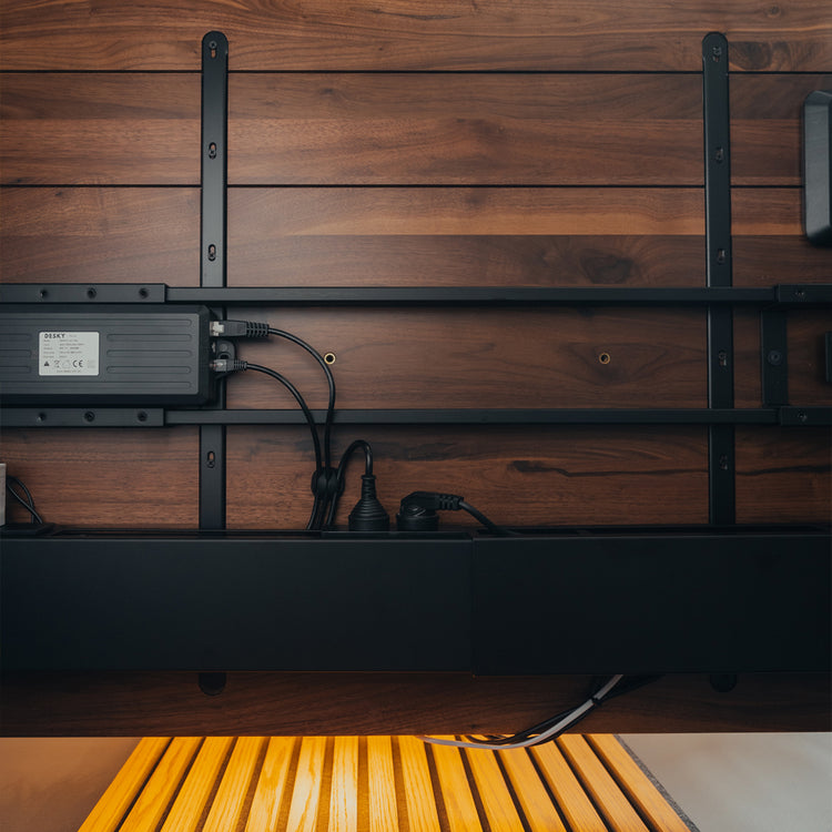 Desky black integrated cable channel power under desk