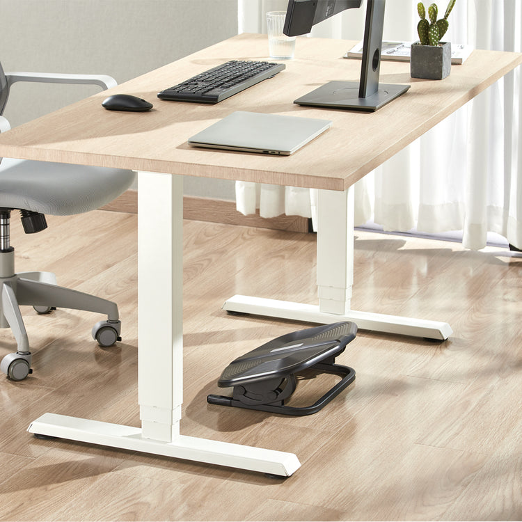 Rippled angled foot rest under standing desk