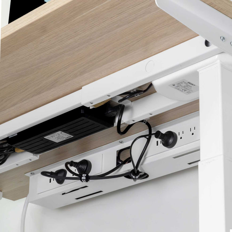 mini cable management channel in white under desk