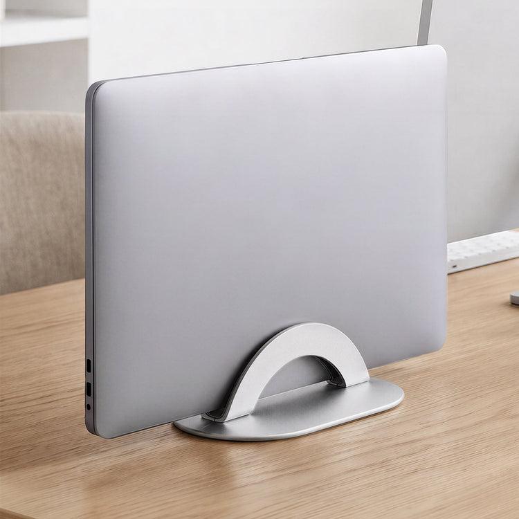 Adjustable laptop stand on top of table with laptop