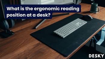 What is the ergonomic reading position at a desk?