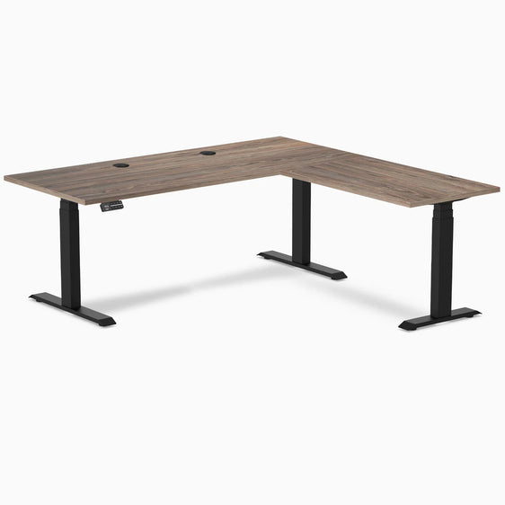 Dual l-shape melamine standing desk - Natural walnut - black 72" with grommets