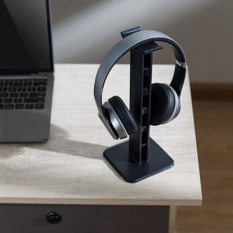 ABs headphone stand in black on table