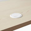 White cable grommet hole on desk