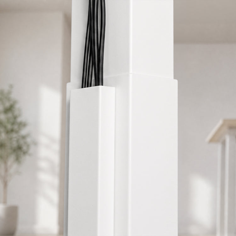 A close-up of a white magnetic cable management holding several black cables