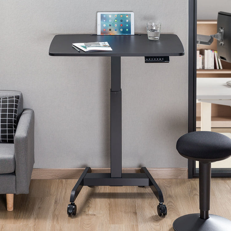 Single sit stand pedestal desk in a corner