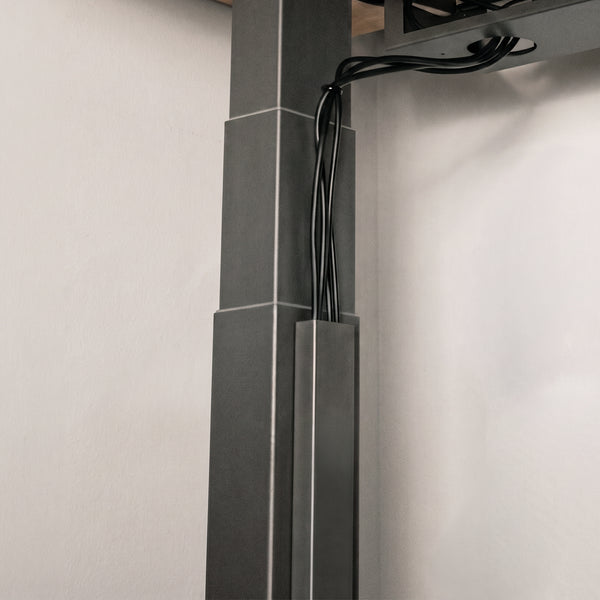 Black Desky magnetic cable management attached on legs